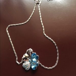 Light blue chain and pendent.